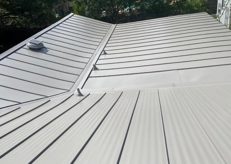 Solar attic fan installed on a metal roof for Roof Ventilation in Paradise